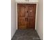Apartment 704 entrance featuring a wood double door at 3131 E Alameda Ave # 704, Denver, CO 80209