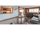 Relaxing living room featuring hardwood floors with arched access to the kitchen and dining areas at 3131 E Alameda Ave # 704, Denver, CO 80209