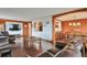 Inviting living room featuring hardwood floors, TV, and seamless access to dining area at 3131 E Alameda Ave # 704, Denver, CO 80209