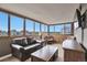 Comfortable living room with large windows offering gorgeous city views at 3131 E Alameda Ave # 704, Denver, CO 80209