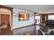 Bright living room with hardwood floors, with arched access to the kitchen and dining areas at 3131 E Alameda Ave # 704, Denver, CO 80209
