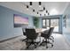 Modern meeting room featuring ample seating, natural light, and stylish decor at 3131 E Alameda Ave # 704, Denver, CO 80209