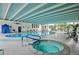 Indoor pool and hot tub area, with abundant natural light at 3131 E Alameda Ave # 704, Denver, CO 80209