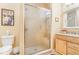 Bathroom with a glass-enclosed shower, vanity with sink, and neutral color scheme at 3221 Autumn Sun Cir, Castle Rock, CO 80104
