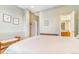 This bright bedroom features a comfy bed, neutral walls, and a view of the attached bathroom at 3221 Autumn Sun Cir, Castle Rock, CO 80104