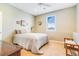 This light-filled bedroom offers a window with a view, a comfy bed, and neutral colors at 3221 Autumn Sun Cir, Castle Rock, CO 80104