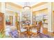 Elegant dining area with hardwood floors, decorative lighting, and seamless access to other rooms at 3221 Autumn Sun Cir, Castle Rock, CO 80104