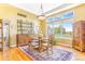 Dining area with hardwood flooring, a chandelier, and large windows that let in natural light at 3221 Autumn Sun Cir, Castle Rock, CO 80104