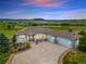 Beautiful single-story home with large driveway, three-car garage, and scenic views at 3221 Autumn Sun Cir, Castle Rock, CO 80104