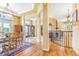 Spacious foyer with hardwood floors, decorative lighting, and views to adjacent dining room at 3221 Autumn Sun Cir, Castle Rock, CO 80104