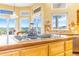 The kitchen island has granite counter tops with cooktop and scenic views at 3221 Autumn Sun Cir, Castle Rock, CO 80104