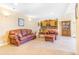 Comfortable living room featuring a sofa, arm chair, and a mini bar at 3221 Autumn Sun Cir, Castle Rock, CO 80104