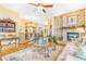Open concept living room with hard wood floors, stone fireplace and staircase at 3221 Autumn Sun Cir, Castle Rock, CO 80104