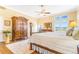 Spacious bedroom with wooden floors, a patterned rug, and large windows with scenic views at 3221 Autumn Sun Cir, Castle Rock, CO 80104