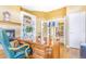 This office features a wooden desk, chair, built in shelves and fireplace at 3221 Autumn Sun Cir, Castle Rock, CO 80104