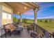 Spacious covered patio featuring comfortable seating and stunning panoramic views of the surrounding landscape at 3221 Autumn Sun Cir, Castle Rock, CO 80104