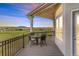 Outdoor patio with wrought iron railing and plenty of space for seating and enjoying a beautiful view at 3221 Autumn Sun Cir, Castle Rock, CO 80104