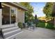 The backyard has a private patio, an outdoor dining area, and comfortable seating at 2026 S Lincoln St, Denver, CO 80210