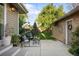 The backyard features a private patio, an outdoor dining area, comfortable seating and manicured lawn at 2026 S Lincoln St, Denver, CO 80210