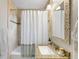 Bathroom featuring a granite vanity and a tiled shower with tub at 2026 S Lincoln St, Denver, CO 80210