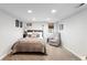 Cozy bedroom features neutral decor, a comfortable bed, and ample natural light at 2026 S Lincoln St, Denver, CO 80210