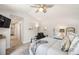 Spacious bedroom featuring a ceiling fan, carpeted floors, and neutral-toned decor at 2026 S Lincoln St, Denver, CO 80210