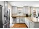Modern kitchen with stainless steel appliances, granite countertops, and ample cabinet space, perfect for cooking at 2026 S Lincoln St, Denver, CO 80210