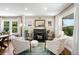 Bright living room with fireplace and seating area, creating a cozy space for relaxation and conversation at 2026 S Lincoln St, Denver, CO 80210