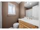 Bathroom with updated vanity, coordinating fixtures, and neutral-colored walls at 9560 W 104Th Ave, Broomfield, CO 80021