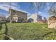 Wide backyard view of a home with a well-maintained lawn and neighboring houses at 9605 Elk Mountain Cir, Littleton, CO 80125