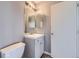 Cozy bathroom featuring a vanity with drawers and a large mirror, and a standard toilet at 9605 Elk Mountain Cir, Littleton, CO 80125