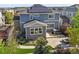 Aerial view of landscaped backyard with hot tub and fire pit at 1665 Diamond Head Dr, Castle Rock, CO 80104