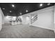 Spacious finished basement with bar seating and stairway at 1665 Diamond Head Dr, Castle Rock, CO 80104