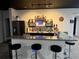Entertainment basement wet bar with ample storage at 1665 Diamond Head Dr, Castle Rock, CO 80104