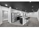 Finished basement featuring granite bar with stainless steel fridge at 1665 Diamond Head Dr, Castle Rock, CO 80104