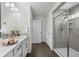Modern bathroom features a glass shower, sleek vanity with white countertops and decorative mosaic tile backsplash at 1665 Diamond Head Dr, Castle Rock, CO 80104