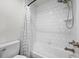 Clean bathroom showcases subway tile shower with a curtain and white fixtures for a sleek, modern design at 1665 Diamond Head Dr, Castle Rock, CO 80104