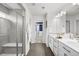 Modern primary bathroom with dual sinks, a glass shower, and contemporary finishes at 1665 Diamond Head Dr, Castle Rock, CO 80104