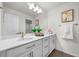 Bright bathroom with a large mirror, double vanity, and elegant decor creates a refreshing and stylish space at 1665 Diamond Head Dr, Castle Rock, CO 80104