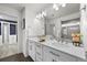 Primary bathroom showcasing double sinks, a shower, and a spacious closet at 1665 Diamond Head Dr, Castle Rock, CO 80104