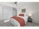 Inviting bedroom featuring a comfortable bed with a decorative throw, stylish lamps, and ample natural light at 1665 Diamond Head Dr, Castle Rock, CO 80104
