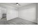 Bright bedroom features soft grey carpet, ceiling fan and closet at 1665 Diamond Head Dr, Castle Rock, CO 80104