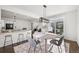 Modern dining room is open to a large island kitchen with barstool seating at 1665 Diamond Head Dr, Castle Rock, CO 80104