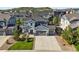 Beautiful two-story home with a well-manicured front yard and a spacious three car garage at 1665 Diamond Head Dr, Castle Rock, CO 80104