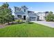 Charming two-story home with a three-car garage and well-maintained lawn at 1665 Diamond Head Dr, Castle Rock, CO 80104