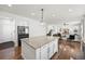 Open concept kitchen boasts a large island with hardwood floors throughout at 1665 Diamond Head Dr, Castle Rock, CO 80104