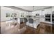 Bright kitchen with modern appliances, granite counters, and bar seating overlooking the dining area at 1665 Diamond Head Dr, Castle Rock, CO 80104