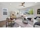 Modern living room with stylish furniture, hardwood flooring, and abundant natural light at 1665 Diamond Head Dr, Castle Rock, CO 80104