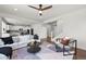 Open concept living area boasts sleek decor, hardwood floors, and bright, airy atmosphere at 1665 Diamond Head Dr, Castle Rock, CO 80104