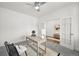 Bright home office featuring a neutral color palette, desk, and French doors at 1665 Diamond Head Dr, Castle Rock, CO 80104